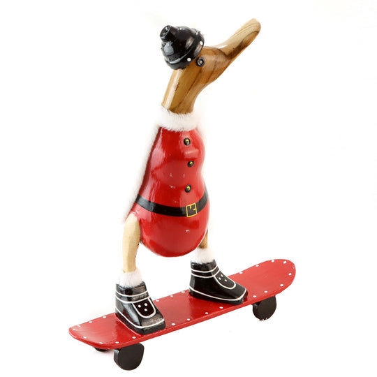 Canard du Père Noël en racine de bambou sur planche à roulettes