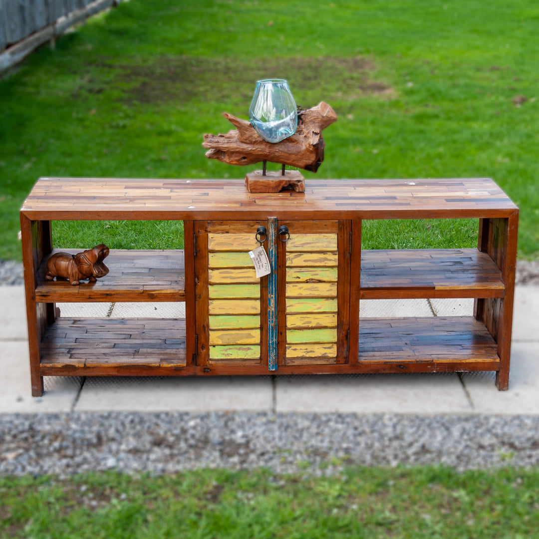 Large teak wood console media unit with distressed paint job and storage shelves.