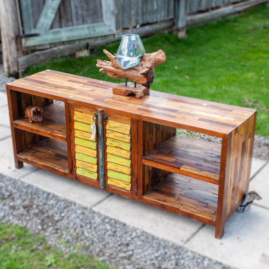 Large teak wood console media unit with distressed paint job and storage shelves.