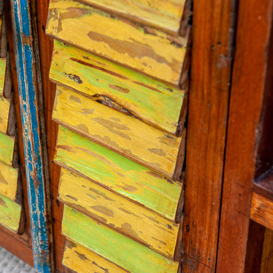 Large teak wood console media unit with distressed paint job and storage shelves.