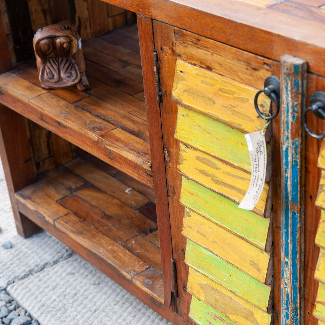 Large teak wood console media unit with distressed paint job and storage shelves.