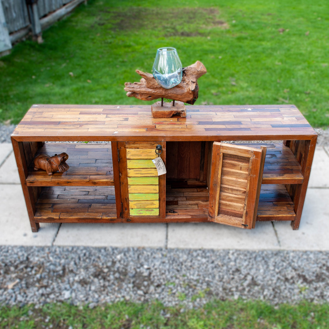 Large teak wood console media unit with distressed paint job and storage shelves.