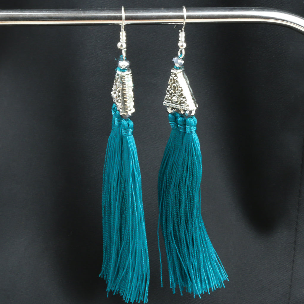 Boucles d'oreilles en argent avec pompon bleu sarcelle