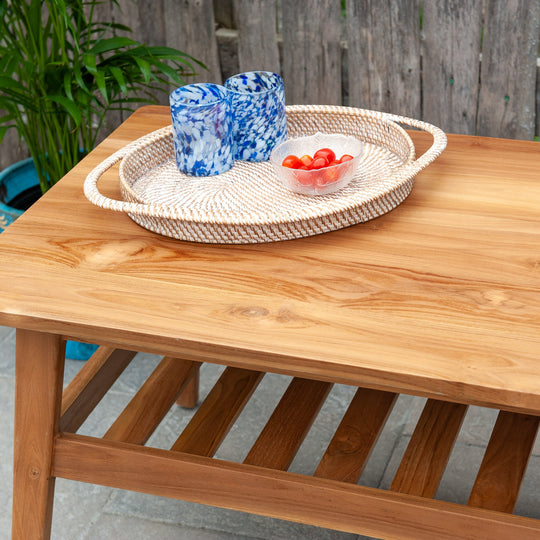 An image of a Javanese Teak Mid-Century Modern (MCM) style coffee table. The table features a sleek design with clean lines and a minimalist aesthetic. Made from rich teak wood, the coffee table showcases the natural beauty of the wood grain, creating a warm and inviting ambiance.