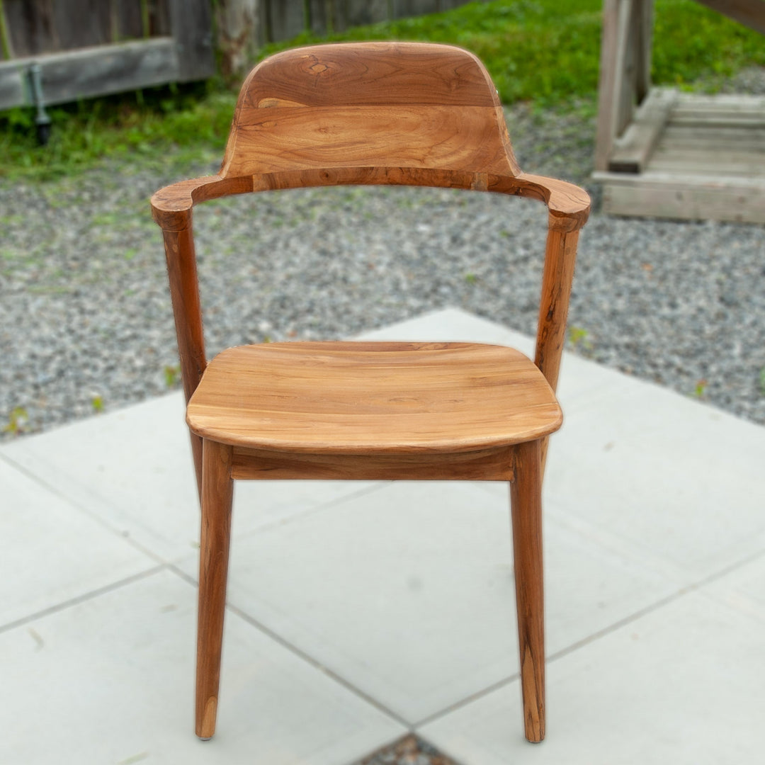 An image of a Javanese Teak Mid-Century Modern (MCM) style dining chair. The chair features a sleek design with clean lines and a minimalist aesthetic. Made from rich teak wood, the dining chair showcases the natural beauty of the wood grain, creating a warm and inviting ambiance.