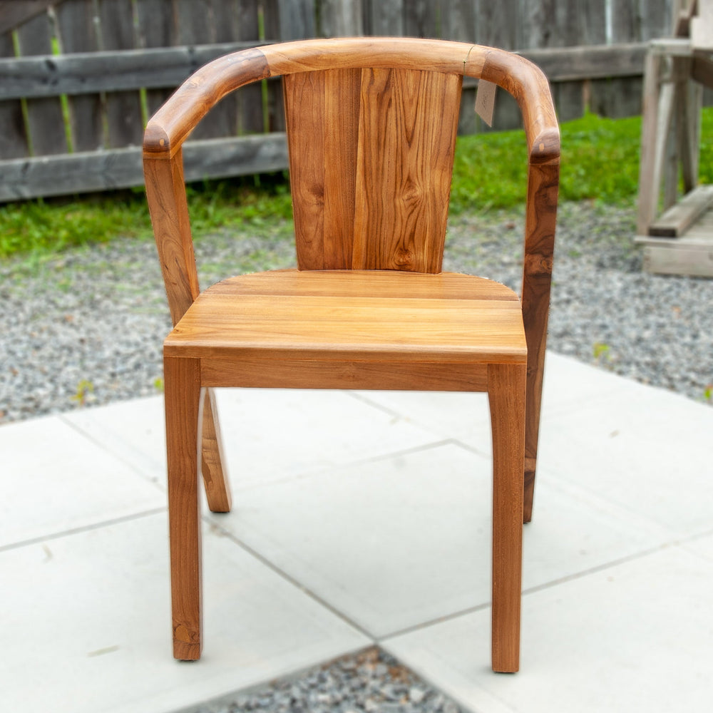 An image of a Javanese Teak Mid-Century Modern (MCM) style dining chair. The chair features a sleek design with clean lines and a minimalist aesthetic. Made from rich teak wood, the dining chair showcases the natural beauty of the wood grain, creating a warm and inviting ambiance.