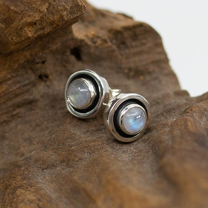 Bali Circle Moonstone Stud Earrings on wood