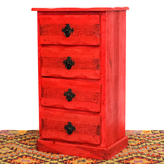 Photo of 4 drawer small mexican dresser in red.