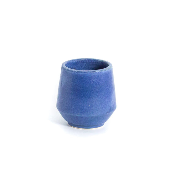 Blue colour cup against white background