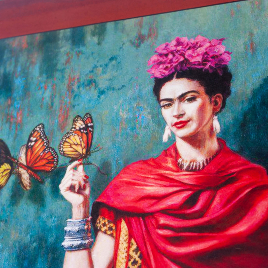 A portrait featuring Freida Kahlo with butterflies on red, wooden background