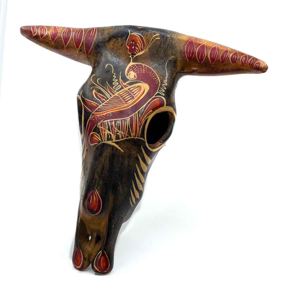 Photo of medium terracotta cow skull with handpainted designs