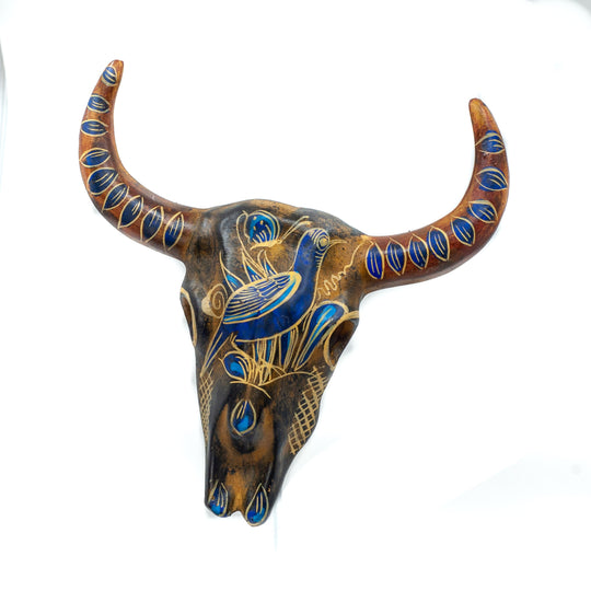 Photo of small terracotta cow skull with handpainted designs