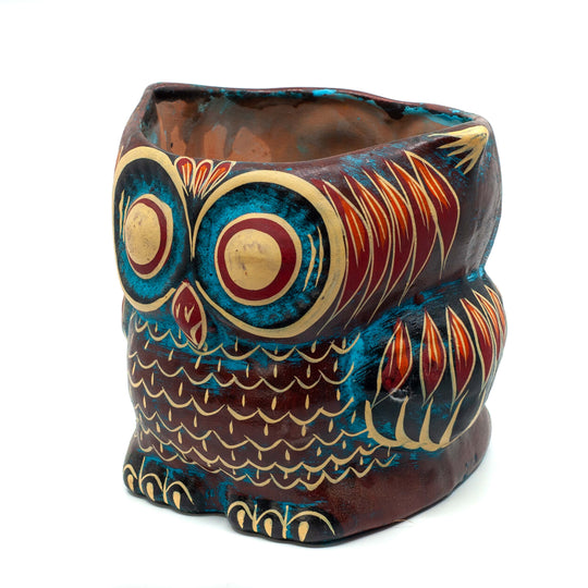 Photo of terracotta hand-painted planter in the shape of an owl 