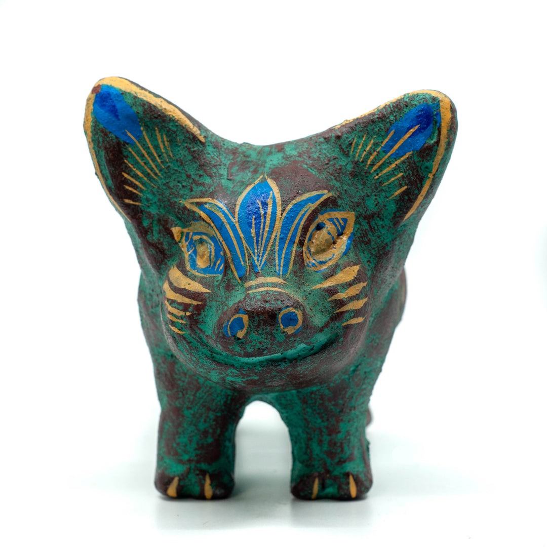 Photo of small terracotta pig plant holder with hand-painted designs