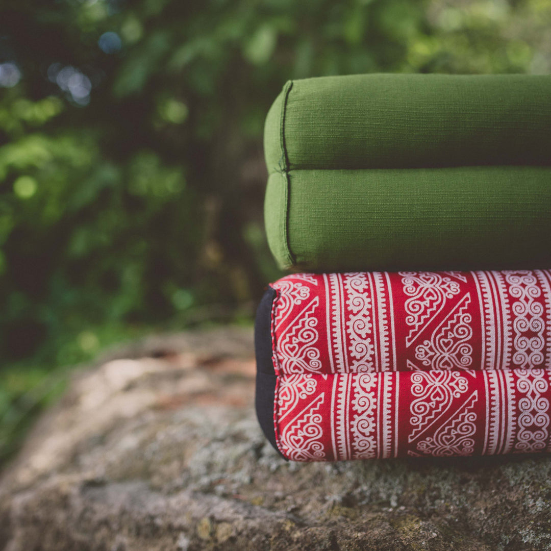 Photo of green and red yoga support cushions