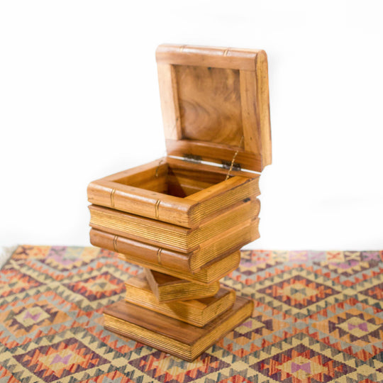 Photo of stacked book shelf style table with a storage opening on top 