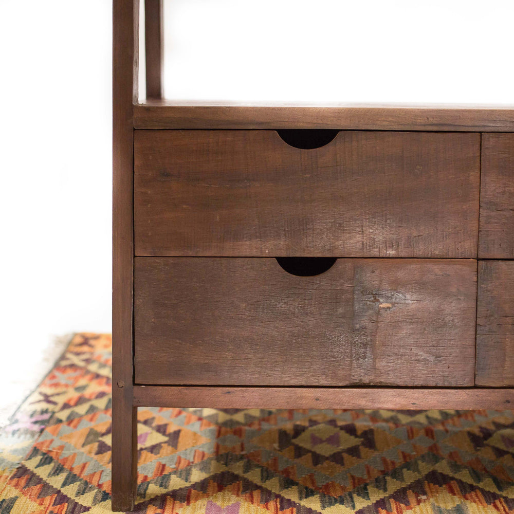 Photo of 4 drawer cabinet in a dark teak wood in an a-frame shape